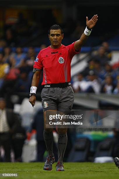 Referee Miguel Angel Ortega gestures during a match between America and Jaguares as part of the 2009 Opening tournament, the closing stage of the...