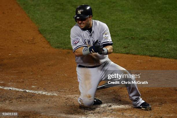 Nick Swisher of the New York Yankees celebrates after he scored on a RBI single hit by Derek Jeter in the top of the fifth inning against the...