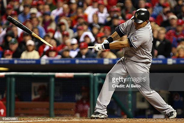 Melky Cabrera of the New York Yankees breaks his bat while hitting against the Philadelphia Phillies in Game Four of the 2009 MLB World Series at...