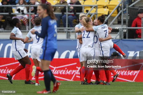 England forward Toni Duggan celebrates with teammates after scoring a goal during the first half of the international game between England and France...