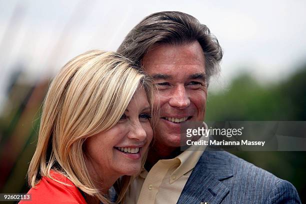 Olivia Newton-John and her husband John Easterling pose after participating in the Emirates Melbourne Cup Parade in Federation Square on November 2,...