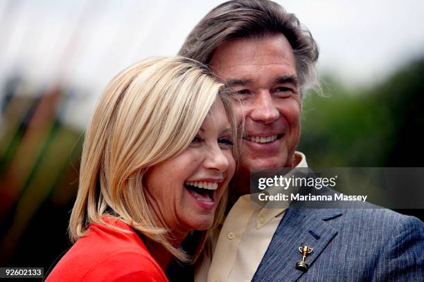 Olivia Newton-John and her husband John Easterling pose after participating in the Emirates Melbourne Cup Parade in Federation Square on November 2,...