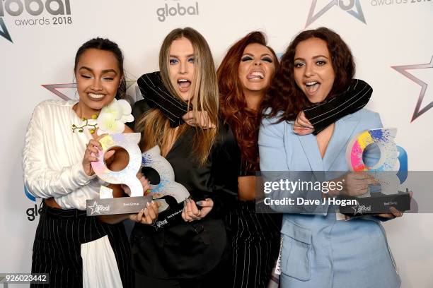 Leigh-Anne Pinnock, Perrie Edwards, Jesy Nelson and Jade Thirlwall of Little Mix win at The Global Awards 2018 at Eventim Apollo, Hammersmith on...