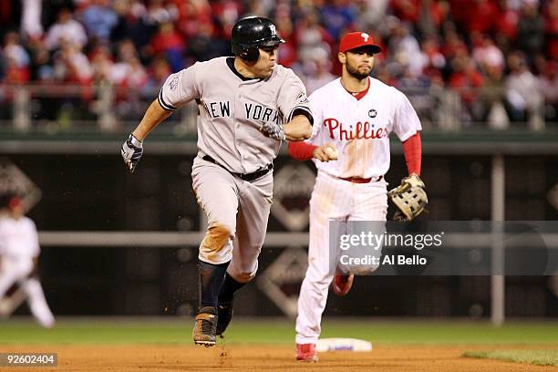 Johnny Damon of the New York Yankees advances to third base after he stole second base in the top of the ninth inning against Pedro Feliz of the...