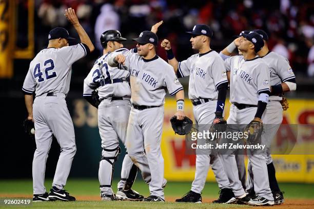 Mariano Rivera, Jorge Posada, Nick Swisher, Derek Jeter and Robinson Cano of the New York Yankees celebrate their 7-4 win against the Philadelphia...
