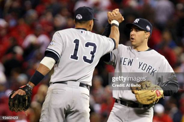 Alex Rodriguez and Mark Teixeira of the New York Yankees celebrate their 7-4 win against the Philadelphia Phillies in Game Four of the 2009 MLB World...