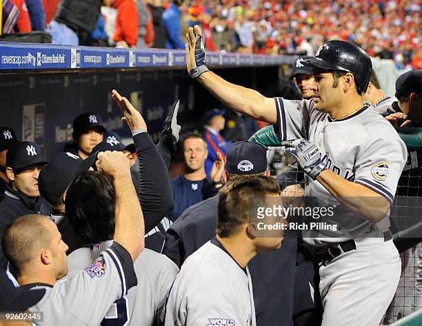 Johnny Damon of the New York Yankees celebrates after scoring in the top of the ninth inning of Game Four of the 2009 MLB World Series at Citizens...