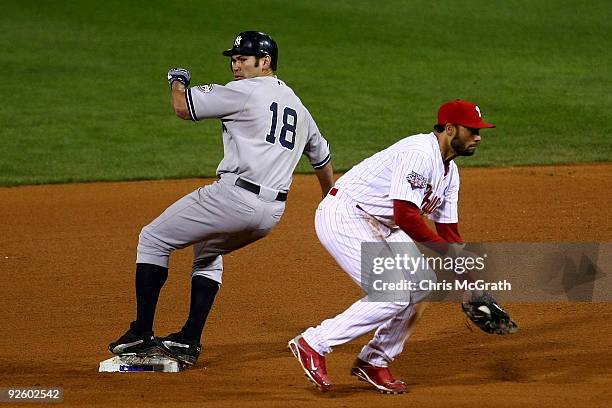 Johnny Damon of the New York Yankees steals second base in the top of the ninth inning against Pedro Feliz of the Philadelphia Phillies in Game Four...