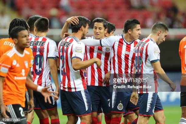 Oswaldo Alanis of Chivas celebrates with his teammates after scoring the first goal of his team during the match between Chivas and Cibao as part of...