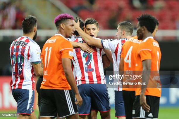 Oswaldo Alanis of Chivas celebrates with his teammates after scoring the first goal of his team during the match between Chivas and Cibao as part of...