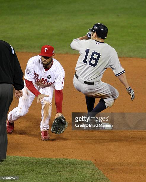 Johnny Damon of the New York Yankees steals second base in the top of the ninth inning of Game Four of the 2009 MLB World Series at Citizens Bank...