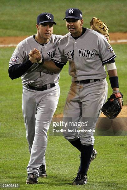 Alex Rodriguez and Mark Teixeira of the New York Yankees celebrate their 7-4 win against the Philadelphia Phillies in Game Four of the 2009 MLB World...