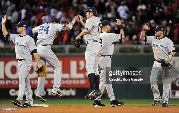 Brett Gardner, Robinson Cano, Johnny Damon, Derek Jeter and Nick Swisher of the New York Yankees celebrate after winning Game Four of the 2009 MLB...