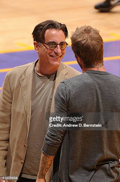 Actor Andy Garcia talks with MLS Soccer player, David Beckham during a break in action at the NBA game between the Los Angeles Lakers and the Atlanta...