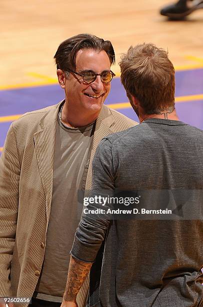 Actor Andy Garcia talks with MLS Soccer player, David Beckham during a break in action at the NBA game between the Los Angeles Lakers and the Atlanta...