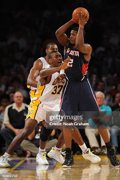 Ron Artest of the Los Angeles Lakers guards against Joe Johnson of the Atlanta Hawks at Staples Center on November 1, 2009 in Los Angeles,...