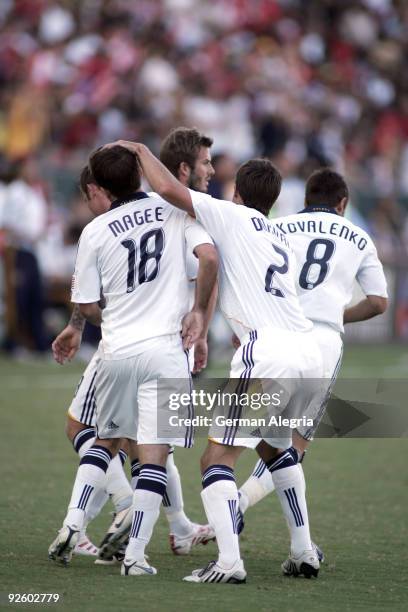 The Los Angeles Galaxy celebrate a goal by Mike Magee in the 14th minute of play against Chivas USA during Game One of the MLS Western Conference...