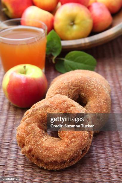 apple cider doughnuts with a glass of apple cider - apple juice stock pictures, royalty-free photos & images