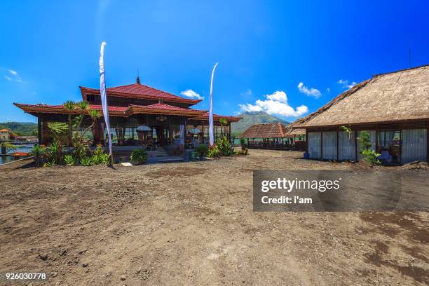 tropical balineses style lake house with beautiful scenery at lake batur, kintamani, bali, indonesia. - kintamani stock pictures, royalty-free photos & images