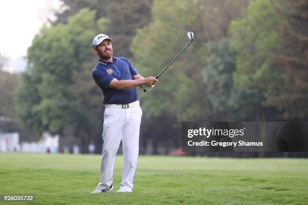 Louis Oosthuizen of South Africa plays his second shot on the 18th hole during the first round of World Golf Championships-Mexico Championship at...