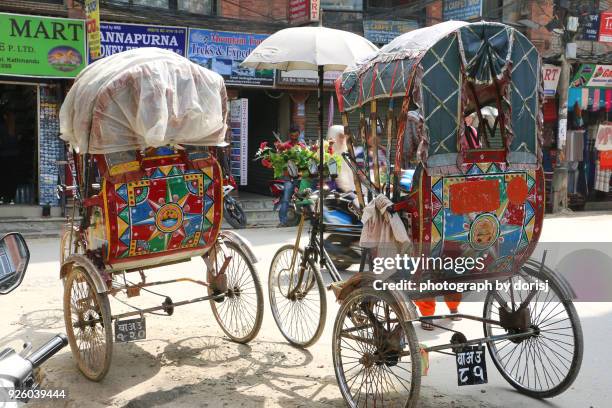 rickshaw in thamel street, kathmandu - thamel stock pictures, royalty-free photos & images