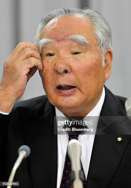 Osamu Suzuki, chairman and chief executive officer of Suzuki Motor Corp., speaks during a news conference announcing the company's second-quarter...