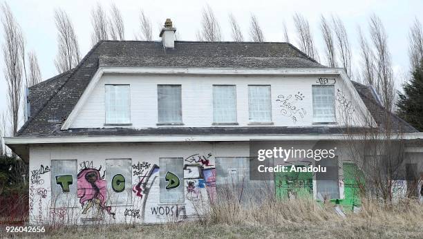 Deserted house painted with graffiti is seen in Doel Village of Antwerp, Belgium on February 1, 2018.