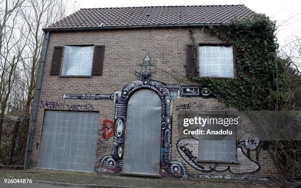 Deserted house painted with graffiti is seen in Doel Village of Antwerp, Belgium on February 1, 2018.