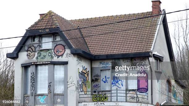 Deserted house painted with graffiti is seen in Doel Village of Antwerp, Belgium on February 1, 2018.