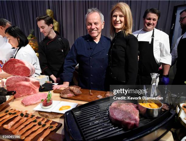Master Chef Wolfgang Puck poses with Academy CEO Dawn Hudson at his master chef table during Governors Ball Press Preview on March 1, 2018 in...