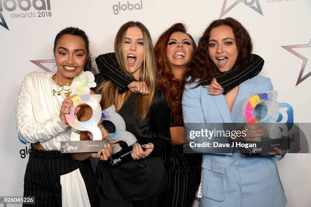 Leigh-Anne Pinnock, Perrie Edwards, Jesy Nelson and Jade Thirlwall of Little Mix win at The Global Awards 2018 at Eventim Apollo, Hammersmith on...