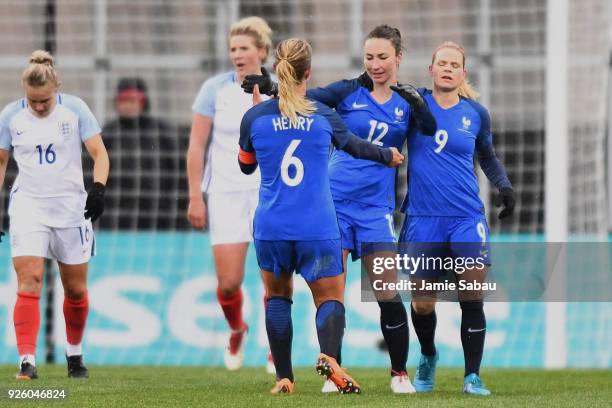 Gaetane Thiney of France celebrates with teammates after scoring for France in the second half against England on March 1, 2018 at MAPFRE Stadium in...