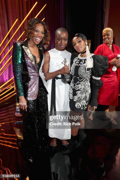 Host Yvonne Orji, Honoree Danai Gurira, and Presenter Janelle Monae pose onstage during the 2018 Essence Black Women In Hollywood Oscars Luncheon at...