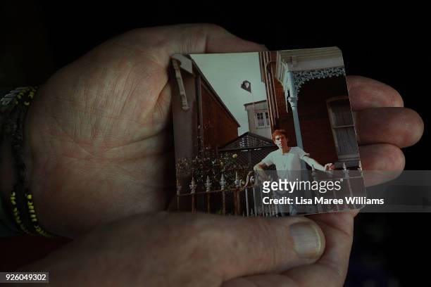 Fabian LoSchiavo a Mardi Gras 78er holds a photograph of himself from 1978 when he flew a pink flag from his home window in protest as seen on March...