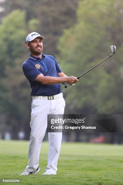 Louis Oosthuizen of South Africa plays his second shot on the 18th hole during the first round of World Golf Championships-Mexico Championship at...