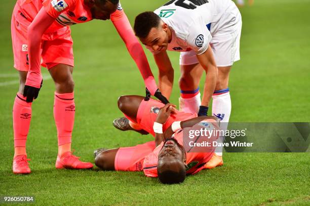 Tiemoko Ismael Diomande of Caen gets the ball in the nuts during the French Cup match between Caen and Lyon at Stade Michel D'Ornano on March 1, 2018...