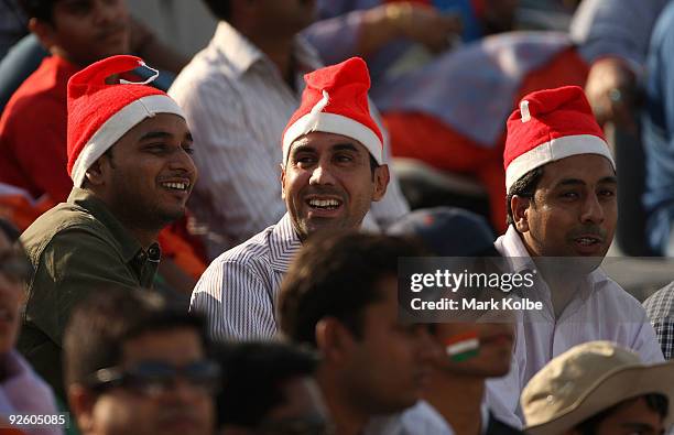 Members of the crowd wearing Christmas hats as they enjoy the atmosphere during the fourth One Day International match between India and Australia at...