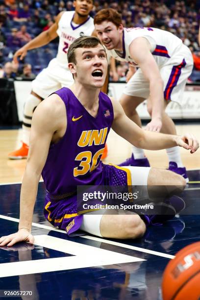 Northern Iowa Panthers guard Spencer Haldeman reacts to a call while on the ground during the first half of an MVC Tournament basketball game between...