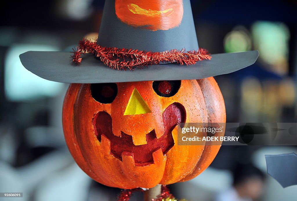 A carved up pumpkin, or jack-o-lantern i