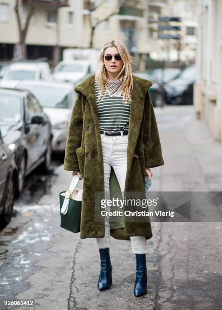 Camille Charriere wearing green teddy coat is seen outside Carven on March 1, 2018 in Paris, France.