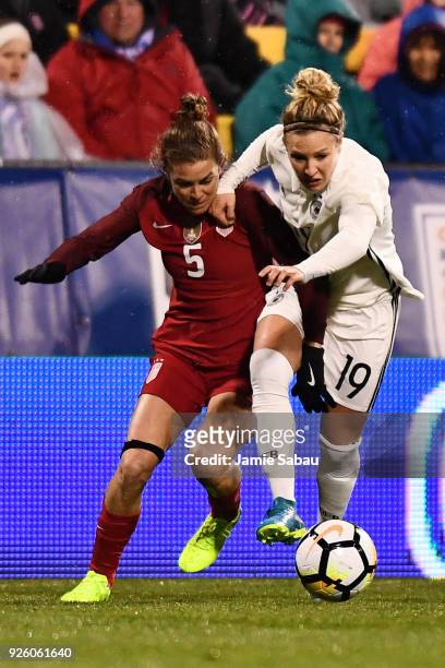 Kelley O'Hara of the US National Team and Svenja Huth of Germany battle for control of the ball in the first half on March 1, 2018 at MAPFRE Stadium...
