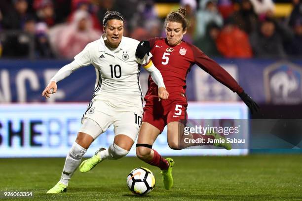 Dzsenifer Marozsan of Germany controls the ball as Kelley O'Hara of the US National Team moves in to defend in the first half on March 1, 2018 at...