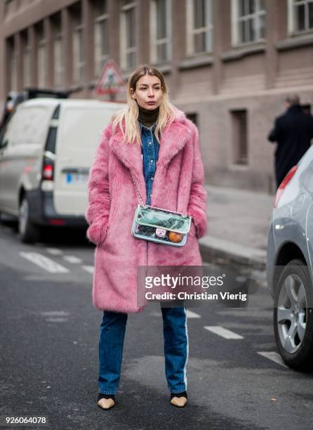 Irina Lakicevic wearing see through Chanel bag, pink teddy coat is seen outside Carven on March 1, 2018 in Paris, France.
