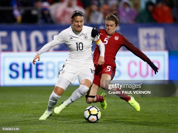 Germany midfielder Dzsenifer Marozsan works against United States defender Kelley O'Hara during the first half of their SheBelieves Cup match at...