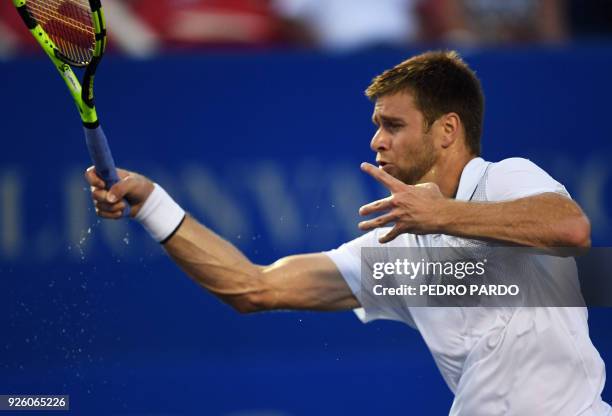 Tennis player Ryan Harrison returns the ball to Germany's Alexander Zverev , during their Mexico ATP 500 Open men's single tennis match in Acapulco,...