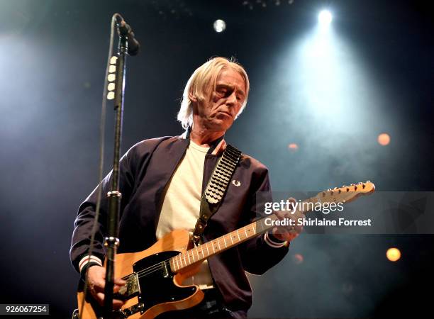 Paul Weller performs live on stage at Manchester Arena on March 1, 2018 in Manchester, England.