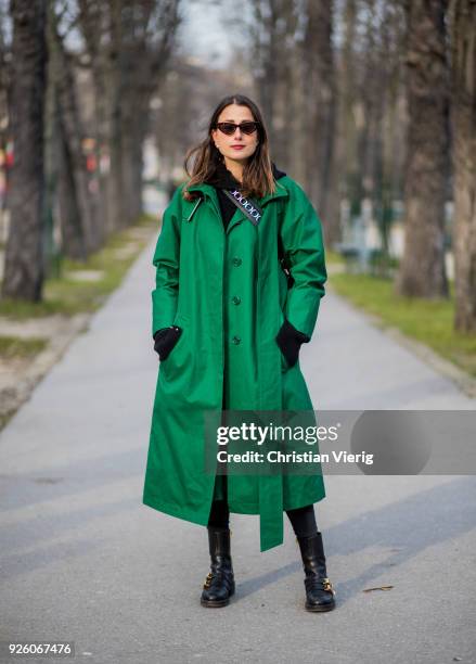 Julia Haghjoo wearing green coat is seen outside Rochas on February 28, 2018 in Paris, France.