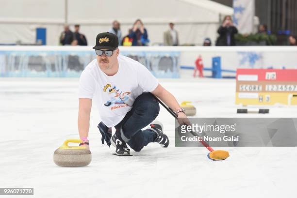 Matt Hamilton of the USA men's curling team joined Cheetos on Thursday to demonstrate to fans how to curl at a curling event at the Bank of America...