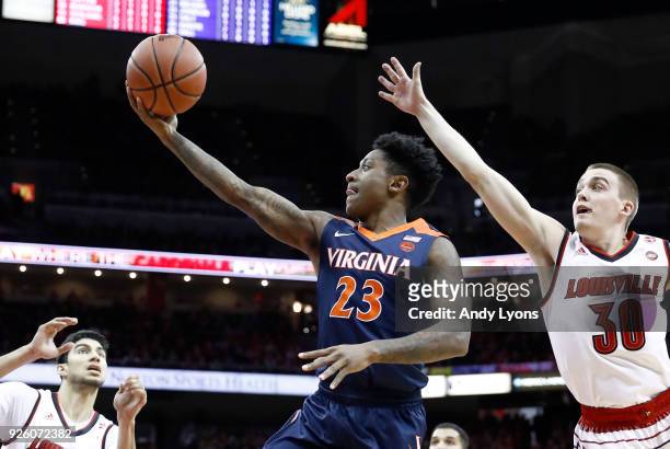 Nigel Johnson of the Virginia Cavaliers shoots the ball against the Louisville Cardinals during the game at KFC YUM! Center on March 1, 2018 in...
