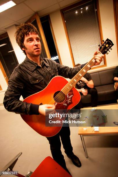 Noel Gallagher plays acoustic guitar backstage at an Oasis concert at the Heineken Music Hall on January 21st, 2009 in Amsterdam, Netherlands.